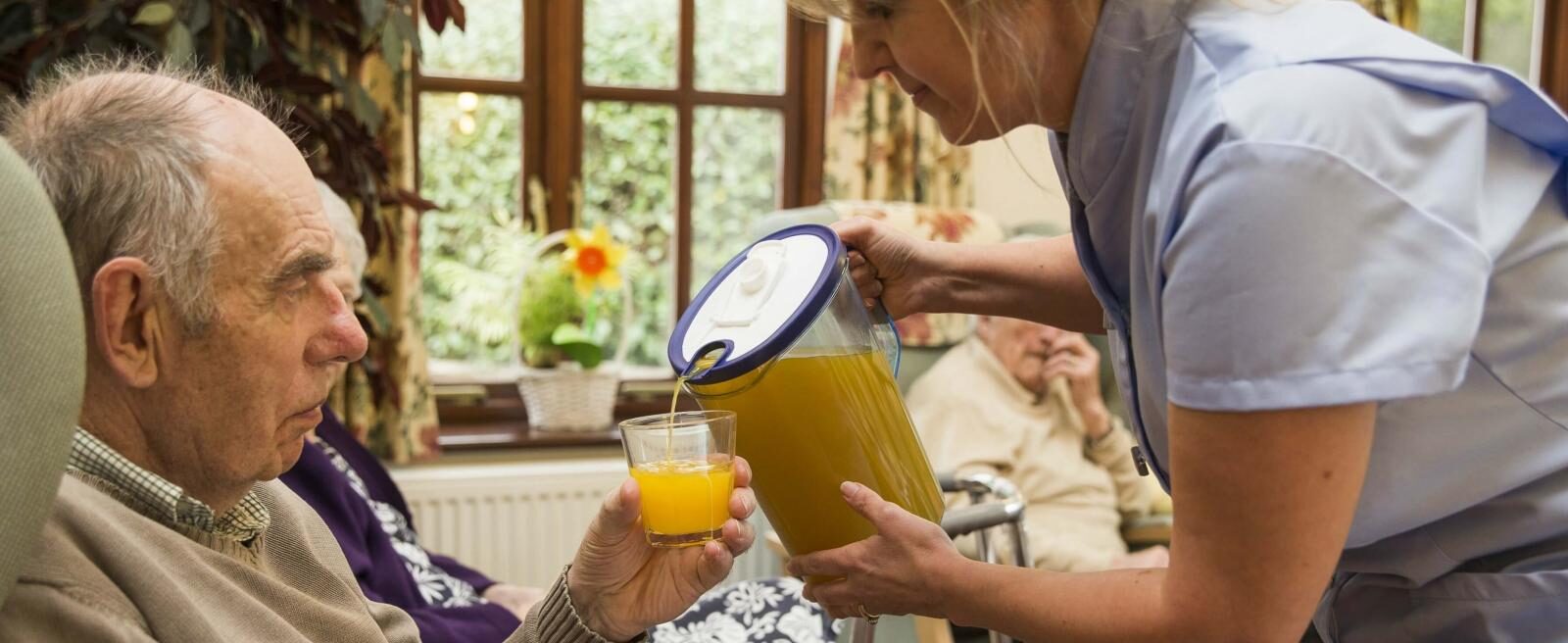 Juice Poured into Glass in Care Home Sector